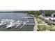 Aerial shot captures a marina with boats docked, adjacent to waterfront buildings offering outdoor dining and lounging areas at 1880 Andell Bluff Blvd # Slip E 9, Johns Island, SC 29455
