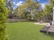 The backyard has a large grassy lawn and a patio area at 1921 Old Parsonage Rd, Charleston, SC 29414