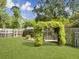 Backyard pergola swing with lush green vines at 1921 Old Parsonage Rd, Charleston, SC 29414