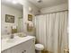 Bathroom featuring a vanity with a sink, a framed mirror, and a shower with a curtain at 1921 Old Parsonage Rd, Charleston, SC 29414