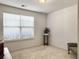 Bedroom featuring neutral carpet, double windows for natural light, and a plant decoration at 1921 Old Parsonage Rd, Charleston, SC 29414