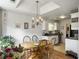Dining area adjoining kitchen with breakfast table and natural light at 1921 Old Parsonage Rd, Charleston, SC 29414