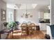 Bright dining area with natural light, chandelier, and views of the kitchen at 1921 Old Parsonage Rd, Charleston, SC 29414