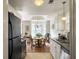 Bright kitchen view of the stainless steel dishwasher and dining room at 1921 Old Parsonage Rd, Charleston, SC 29414