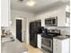 Efficient kitchen with white cabinets and stainless steel appliances at 1921 Old Parsonage Rd, Charleston, SC 29414