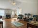 Bright living room with hardwood floors, fireplace, and large windows for natural light at 1921 Old Parsonage Rd, Charleston, SC 29414