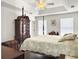 Spacious main bedroom featuring trey ceilings, multiple windows and a four poster bed at 1921 Old Parsonage Rd, Charleston, SC 29414