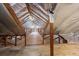 Spacious attic with wooden beams and flooring offering potential for storage or renovation at 200 Broughton Rd, Moncks Corner, SC 29461