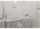 Accessible white walk-in bathtub with safety bar and handheld shower head at 200 Broughton Rd, Moncks Corner, SC 29461