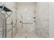 Modern bathroom features a zero-entry shower with grab bars, tile surround, and built-in shelves at 200 Broughton Rd, Moncks Corner, SC 29461