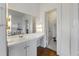 Bathroom with vanity, large mirror, and doorway to the toilet and shower area at 200 Broughton Rd, Moncks Corner, SC 29461