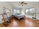 Spacious bedroom features hardwood floors, multiple windows, and a rocking chair at 200 Broughton Rd, Moncks Corner, SC 29461