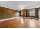 Spacious bedroom with hardwood floors, wood paneling, ceiling fan and bright windows at 200 Broughton Rd, Moncks Corner, SC 29461