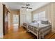 Charming bedroom features two twin beds, hardwood floors, and wallpapered walls at 200 Broughton Rd, Moncks Corner, SC 29461