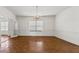 Bright dining room with hardwood floors, white walls, and elegant chandelier at 200 Broughton Rd, Moncks Corner, SC 29461