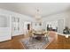 Staged dining room with hardwood floors, white walls, and chandelier at 200 Broughton Rd, Moncks Corner, SC 29461
