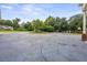 Large driveway with ample parking space surrounded by lush landscaping at 200 Broughton Rd, Moncks Corner, SC 29461