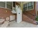 Close view of porch lift outside the house, sitting on a brick foundation at 200 Broughton Rd, Moncks Corner, SC 29461