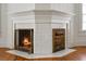 Stunning fireplace with decorative metalwork and white tile surround at 200 Broughton Rd, Moncks Corner, SC 29461