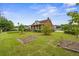 Inviting property with manicured grounds, front porch, and potential garden plots at 200 Broughton Rd, Moncks Corner, SC 29461