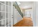 Hallway with skylight, stairs, and doorway to rooms with hardwood floors at 200 Broughton Rd, Moncks Corner, SC 29461