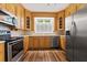 Kitchen features stainless steel appliances, wooden cabinets, and hardwood floors at 200 Broughton Rd, Moncks Corner, SC 29461