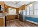 Kitchen has wood cabinets and stainless steel refrigerator at 200 Broughton Rd, Moncks Corner, SC 29461