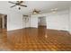 Spacious living room features hardwood floors, ceiling fans, and bright, white walls at 200 Broughton Rd, Moncks Corner, SC 29461