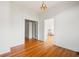Bright room with hardwood floors and paneled walls, connecting to other rooms via doorways at 200 Broughton Rd, Moncks Corner, SC 29461