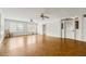 Bright living room with beautiful hardwood floors, large windows, and fresh white walls at 200 Broughton Rd, Moncks Corner, SC 29461