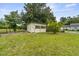 Lawn view of outdoor shed with screen panels and double doors on a green lawn at 200 Broughton Rd, Moncks Corner, SC 29461