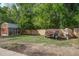 Backyard features a tool shed, a grassy area, a privacy fence, and room to park a trailer at 201 Judith Dr, Summerville, SC 29485