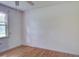 A light and airy bedroom is complete with hardwood floors, a window, and white walls at 201 Judith Dr, Summerville, SC 29485