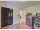This bedroom boasts hardwood floors, a storage unit, and a closet with dark wood folding doors at 201 Judith Dr, Summerville, SC 29485