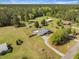 Expansive property with a fenced pool, outbuildings, large lawn, and access to a wooded area at 208 Mini Farm Rd, Bonneau, SC 29431