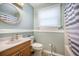 Well-lit bathroom with a vanity, toilet, shower and tub combo at 208 Mini Farm Rd, Bonneau, SC 29431