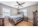 Bedroom with a bed, fan, two windows and wood-look flooring at 208 Mini Farm Rd, Bonneau, SC 29431