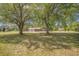 Beautiful home with mature shade trees, long driveway, and a well-manicured lawn at 208 Mini Farm Rd, Bonneau, SC 29431