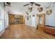 Spacious living room featuring a brick fireplace, built-in shelving, and lots of unique decor at 208 Mini Farm Rd, Bonneau, SC 29431