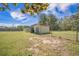 Backyard outbuilding surrounded by a fenced-in area at 208 Mini Farm Rd, Bonneau, SC 29431