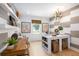 Bright office space with stylish decor, modern lighting, and ample natural light; perfect for a productive work environment at 208 Quimby Hill Dr, Huger, SC 29450