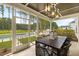A charming outdoor patio featuring a dining table and view of a beautiful backyard with a pool at 208 Quimby Hill Dr, Huger, SC 29450
