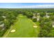 Aerial view of the community golf course featuring mature trees and winding cart paths on a sunny day at 23 Hunters Forest Dr, Charleston, SC 29414