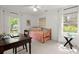 Bedroom with desk, chair, daybed, and two large windows for ample natural light at 23 Hunters Forest Dr, Charleston, SC 29414