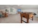 Large finished bonus room with foosball table, TV, and space for recreation at 23 Hunters Forest Dr, Charleston, SC 29414