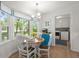 Bright breakfast nook features a bay window, laundry room access, and a breakfast table at 23 Hunters Forest Dr, Charleston, SC 29414