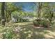 Classic home with a well-maintained front lawn and colorful flowering shrubs at 23 Hunters Forest Dr, Charleston, SC 29414