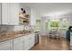 Bright kitchen features stainless steel appliances, granite countertops, and adjacent breakfast nook with bay window at 23 Hunters Forest Dr, Charleston, SC 29414