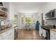 Bright kitchen features stainless steel appliances, granite countertops, and adjacent breakfast nook with bay window at 23 Hunters Forest Dr, Charleston, SC 29414