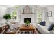 Vaulted living room features a fireplace, hardwood floors, and comfortable seating at 23 Hunters Forest Dr, Charleston, SC 29414
